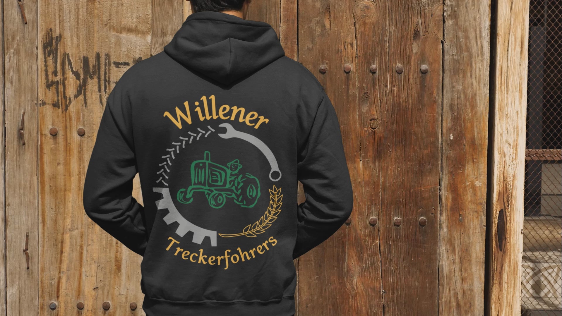 Video laden: Video zeigt einen schwarzen TuS Middels Hoodie mit gelbem Vereinslogo auf der Brust und großem Rückendruck „Mein Verein!“ im Splash-Design.